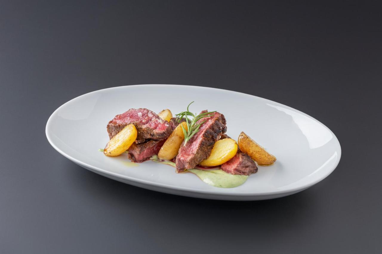 Eurostars Portico Alicante Exterior photo A steak with potatoes